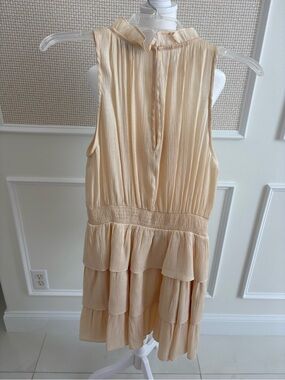 Tiered ruffle metallic dress in flattering flowy party-girl vibe.